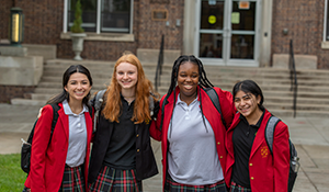 Girls smiling on STA campus